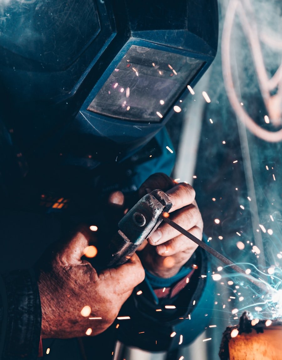 Certified welder working on a structural steel assembly